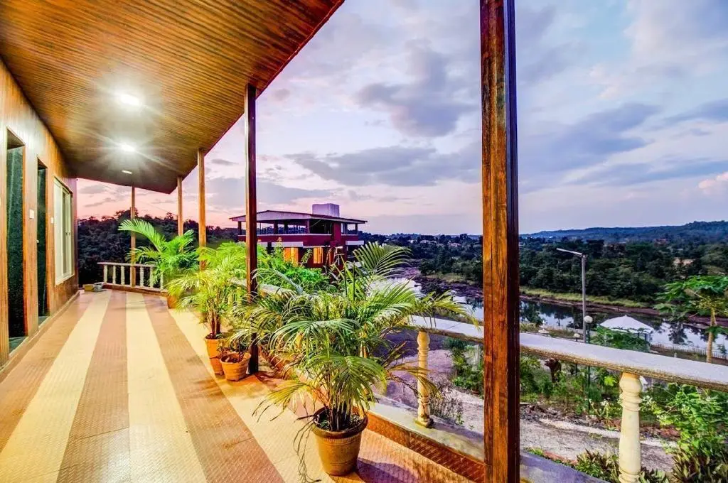 the resort in Karjat for family vacations, surrounded by lush greenery and scenic mountain views.